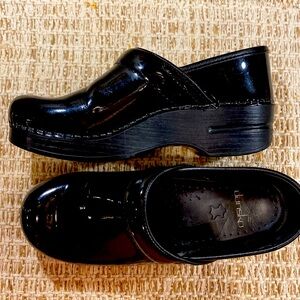 Dansko black patent leather clogs